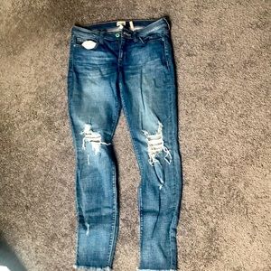 Distressed blue jeans